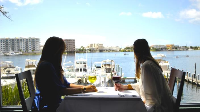Sushi and wine at Marina Cafe during happy hour in Destin Florida