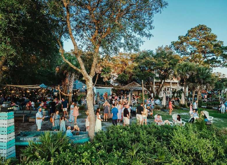 Guests enjoying live music on the lawn at Old Florida Fish House
