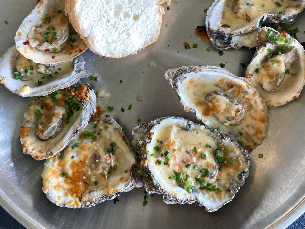 Oysters and beer with a beach view at Shunk Gulley Oyster Bar